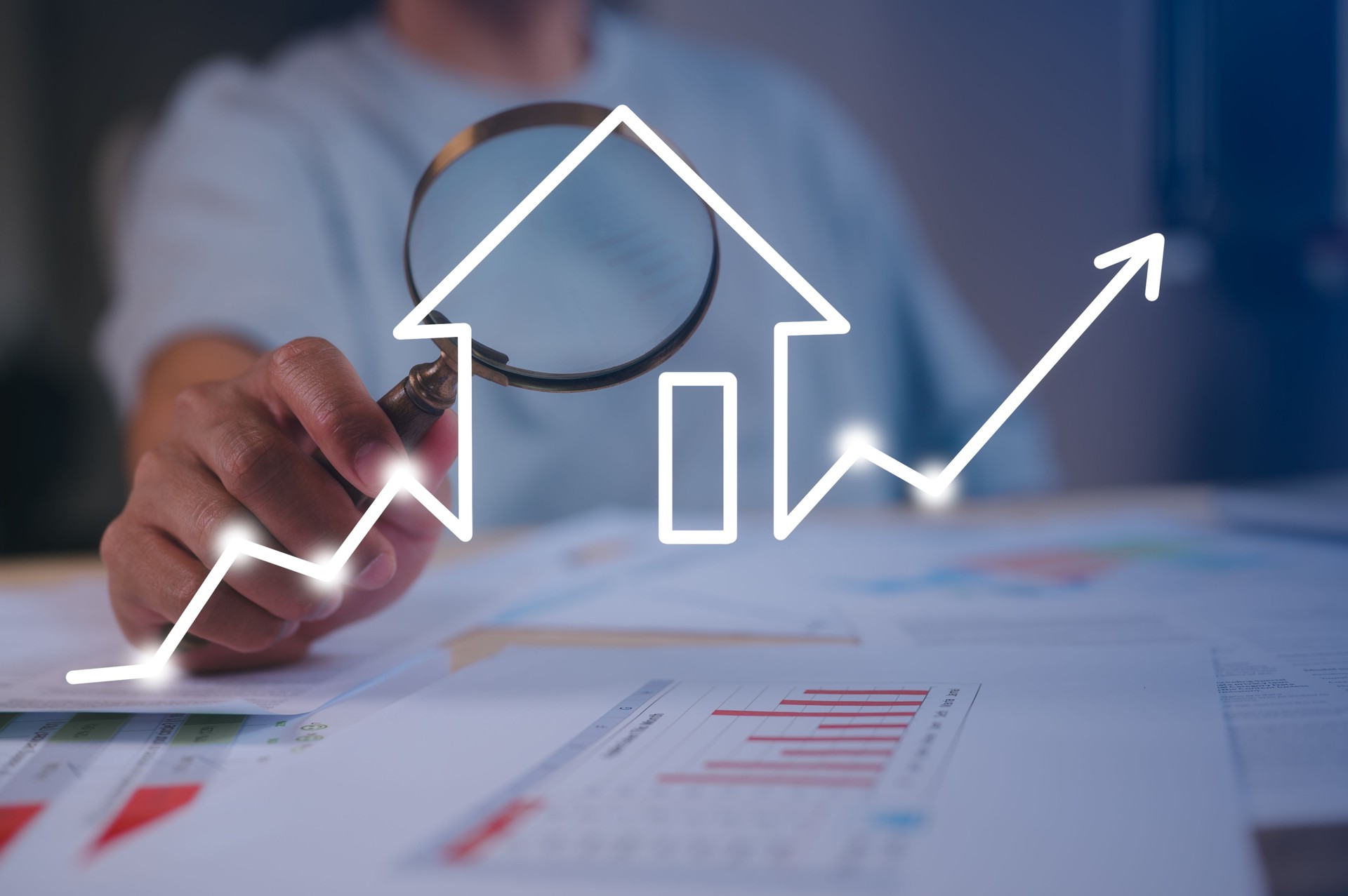 Businessman holding magnifying glass An investor studying real estate market trends with a magnifying glass real estate investment concept energy efficiency rating and property value